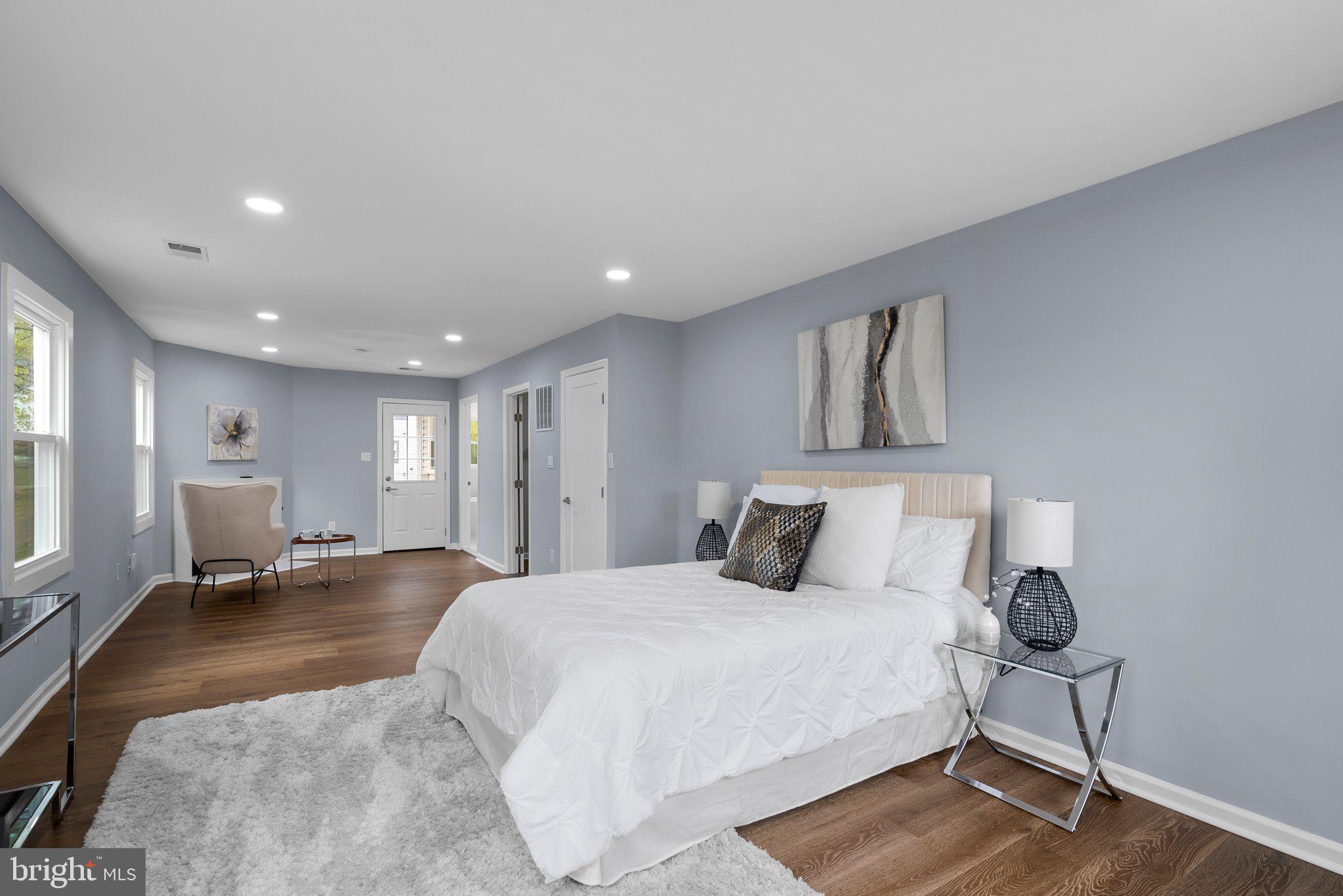 2924 Hunter Road Fairfax, VA 22031 - Photo 26 of 79 a large bedroom with a bed and wooden floor