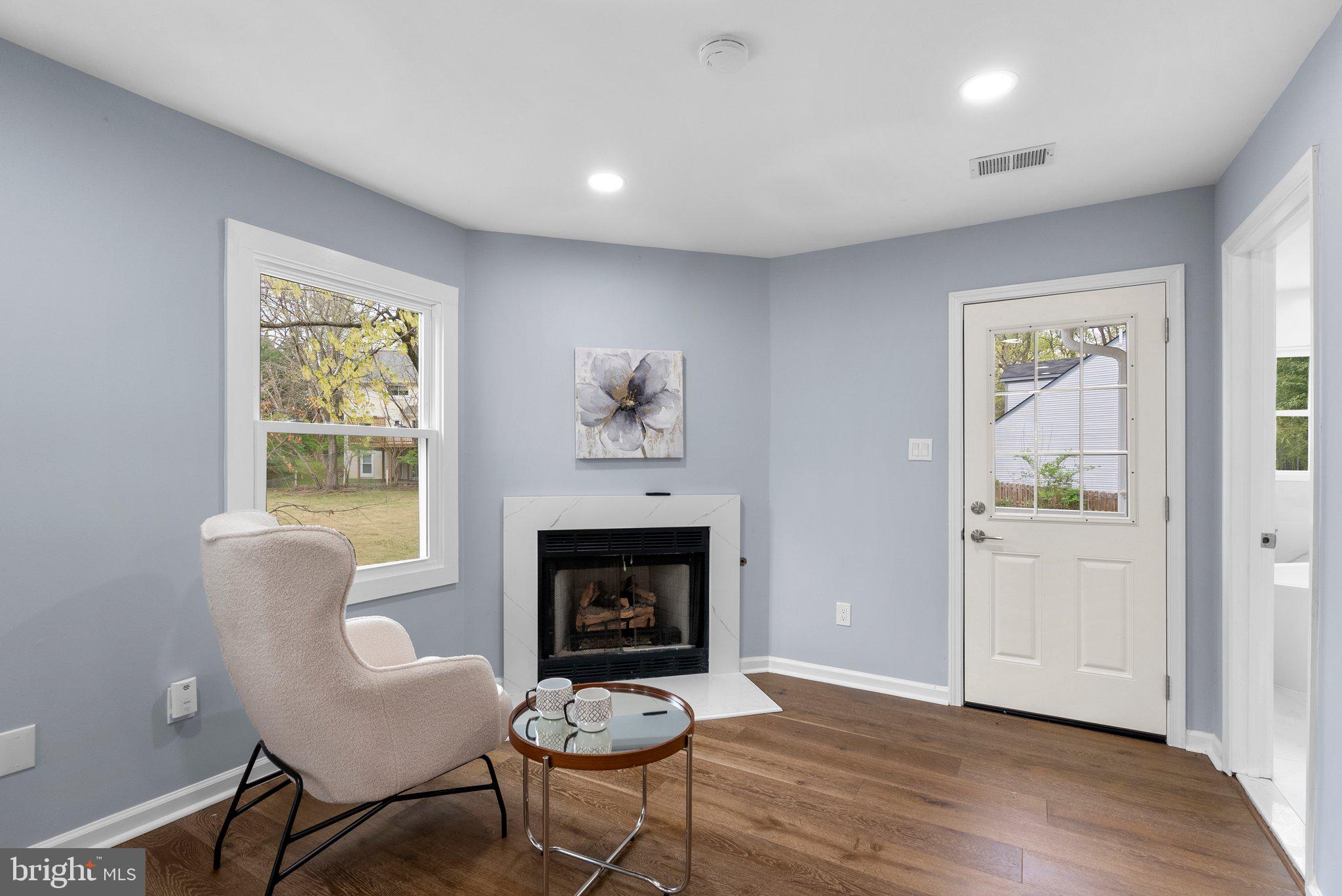 2924 Hunter Road Fairfax, VA 22031 - Photo 28 of 79 a living room with furniture and a fireplace