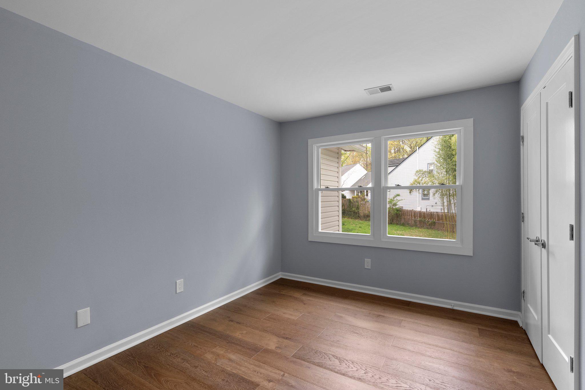 2924 Hunter Road Fairfax, VA 22031 - Photo 32 of 79 an empty room with wooden floor and windows