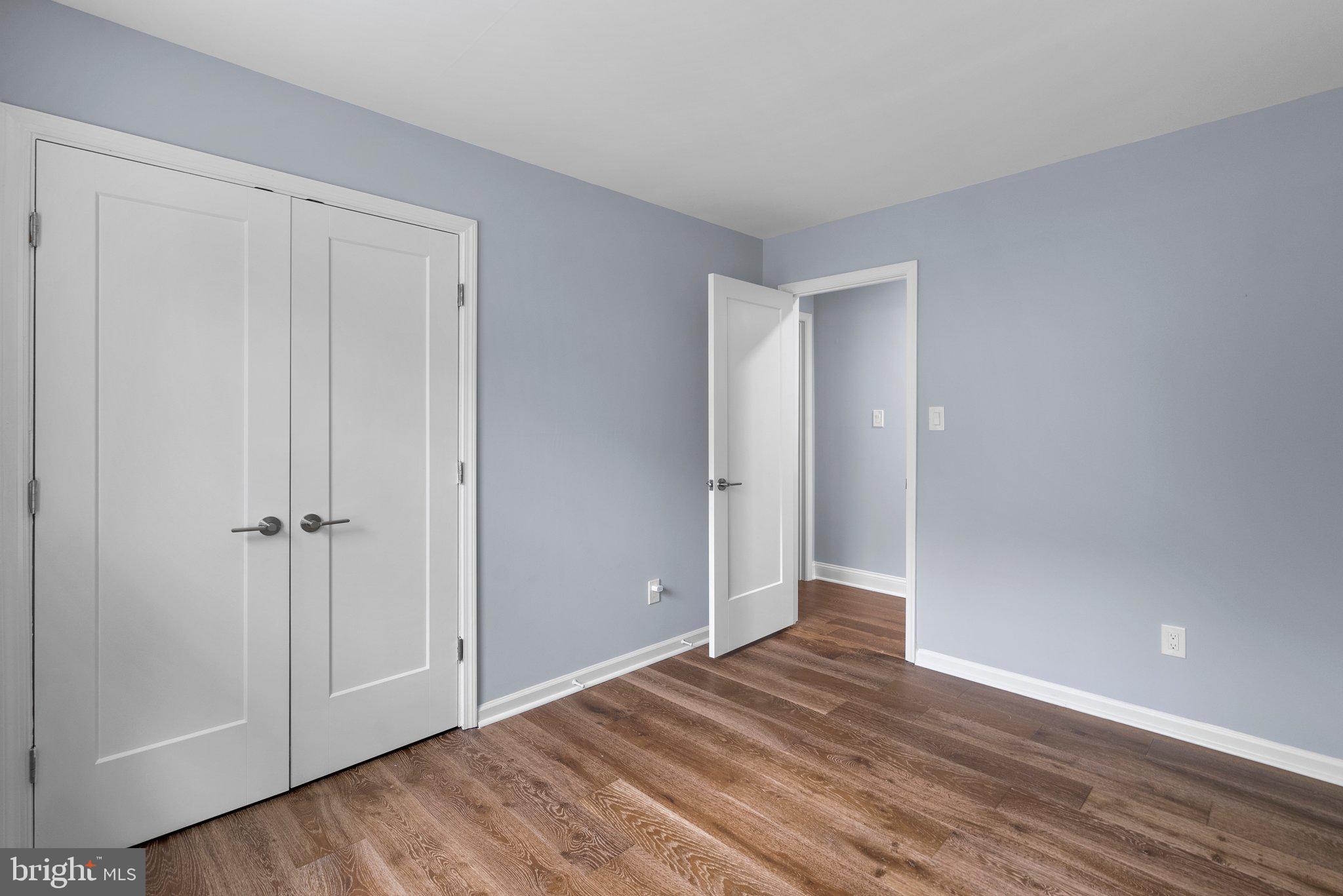 2924 Hunter Road Fairfax, VA 22031 - Photo 34 of 79 a view of an empty room with closet and wooden floor