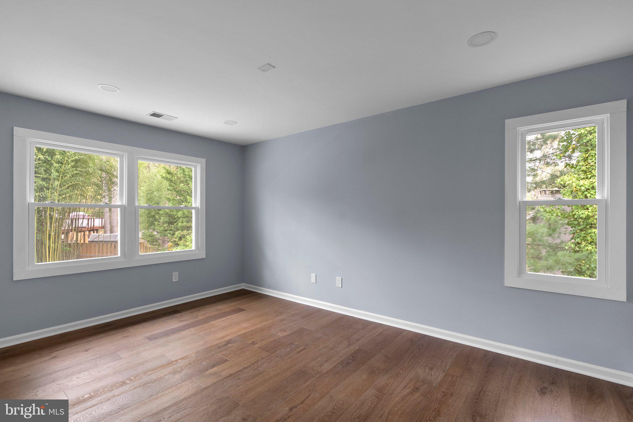 2924 Hunter Road Fairfax, VA 22031 - Photo 35 of 79 a view of an empty room with wooden floor and a window