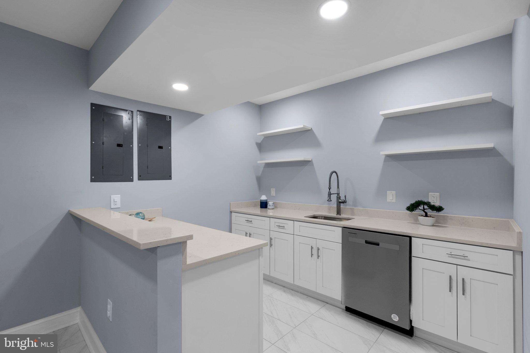 2924 Hunter Road Fairfax, VA 22031 - Photo 46 of 79 a kitchen with a sink a stove and cabinets