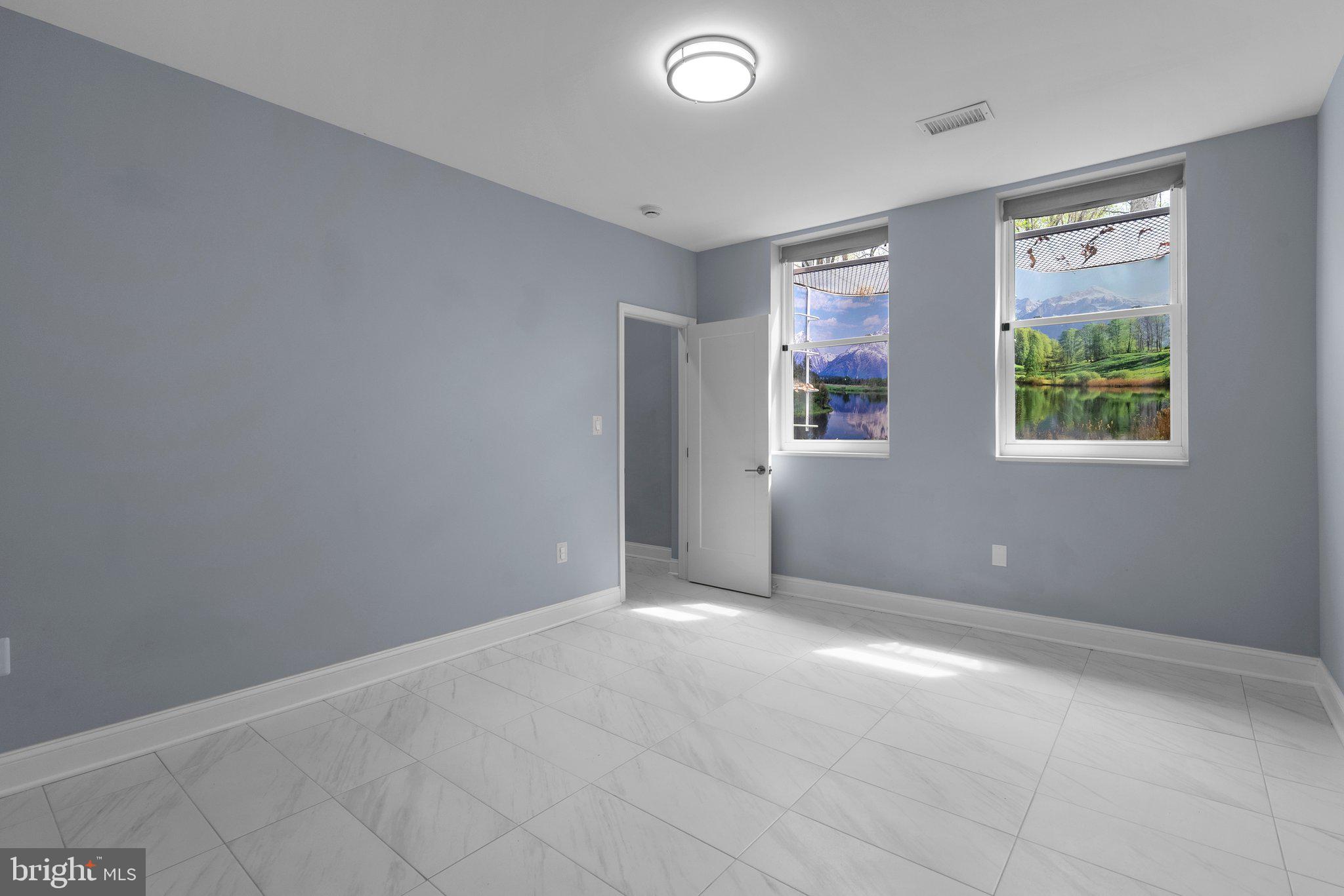 2924 Hunter Road Fairfax, VA 22031 - Photo 49 of 79 an empty room with windows and closet