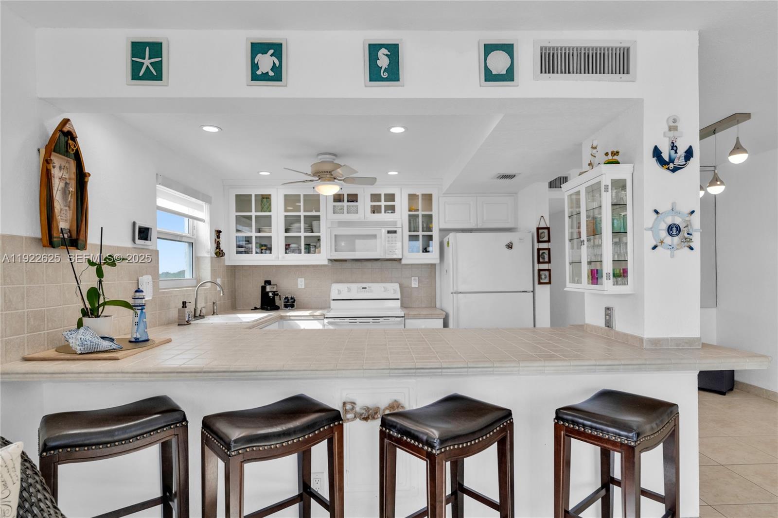 400 North Surf Road, Unit 506 Hollywood, FL 33019 - Photo 12 of 37 a living room with granite countertop furniture and a kitchen view