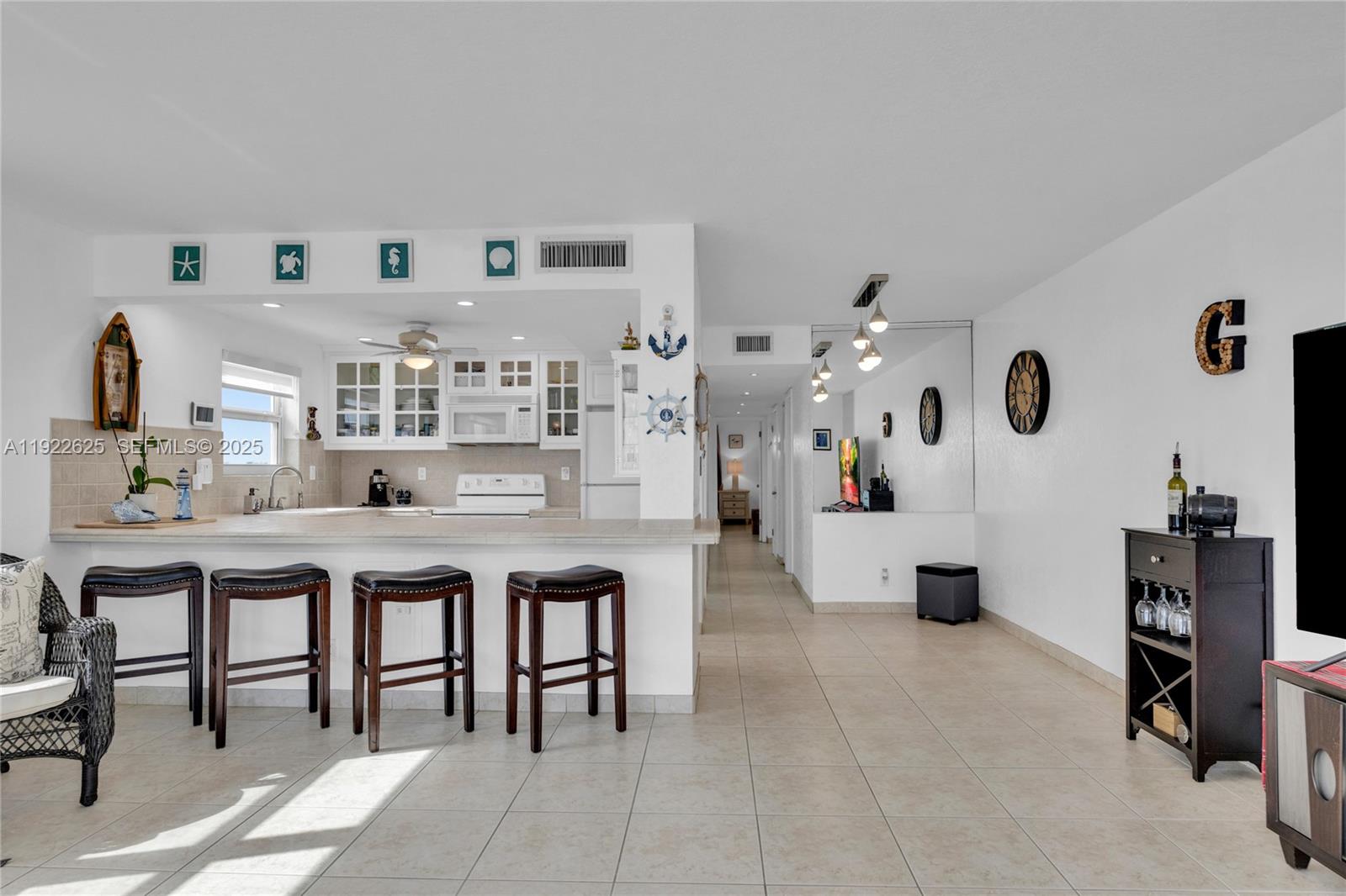 400 North Surf Road, Unit 506 Hollywood, FL 33019 - Photo 13 of 37 a living room with furniture and white walls
