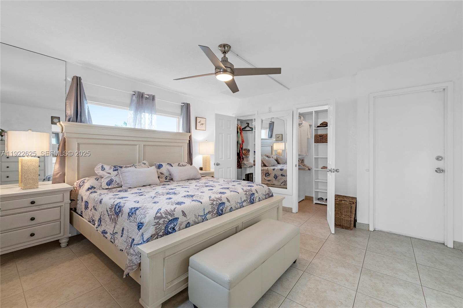400 North Surf Road, Unit 506 Hollywood, FL 33019 - Photo 17 of 37 a bedroom with a bed and ceiling fan