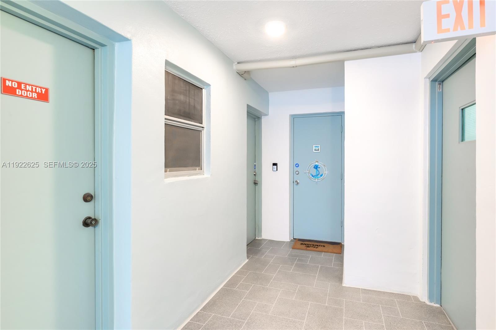 400 North Surf Road, Unit 506 Hollywood, FL 33019 - Photo 35 of 37 a view of a hallway with closet and bathroom