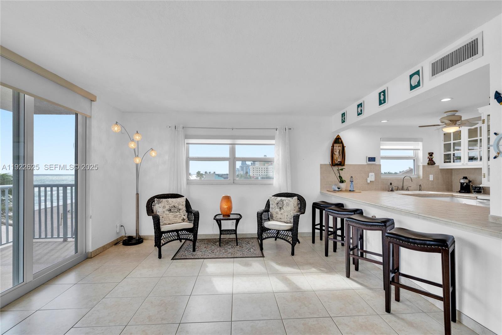 400 North Surf Road, Unit 506 Hollywood, FL 33019 - Photo 9 of 37 a view of a dining room kitchen and a dining table chair