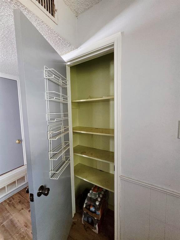 722 South Church Street Pilot Point, TX 76258 - Photo 35 of 37 a room with a walk in closet and a window