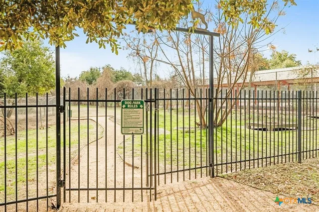 a white wall with paintings on it and wall