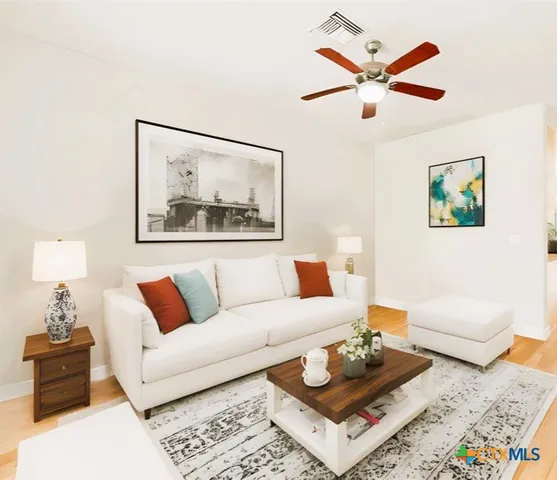 a living room with furniture and a rug