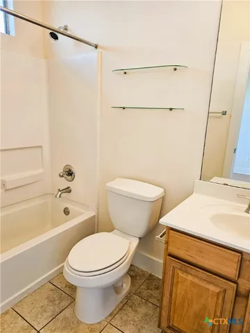 a bathroom with a toilet a sink and a bathtub
