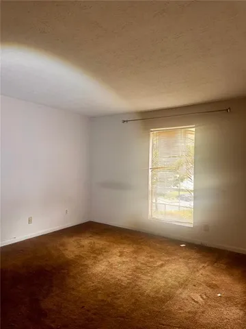 a view of empty room with windows