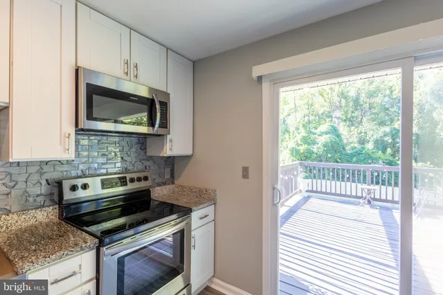 a kitchen with a stove and a microwave