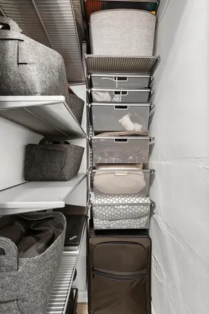 a bathroom with a sink a toilet a mirror and shower