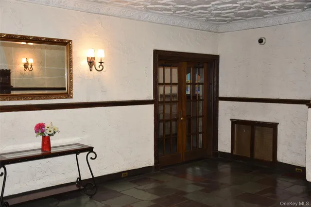 a view of an entryway with wooden floor