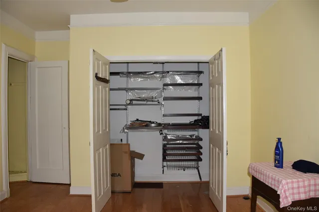 a kitchen with a refrigerator and a stove top oven
