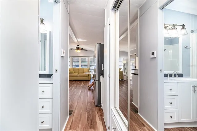 a view of a walk in closet with living room