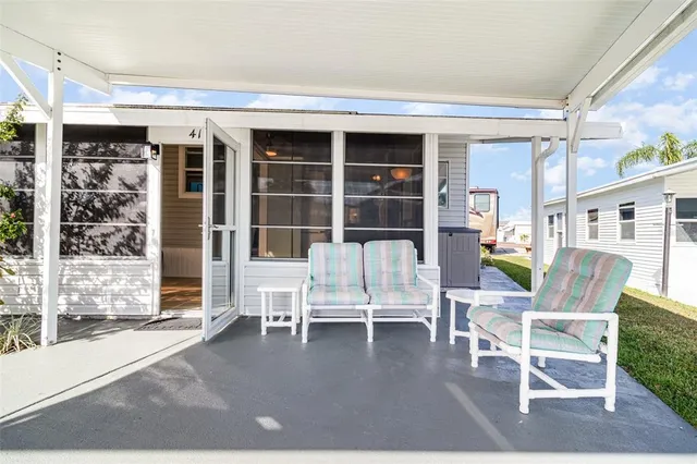 a dining room with wooden floor and a glass door