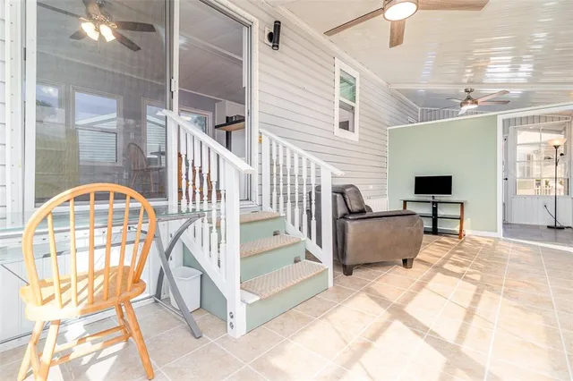 a view of living room kitchen with furniture and flat screen tv