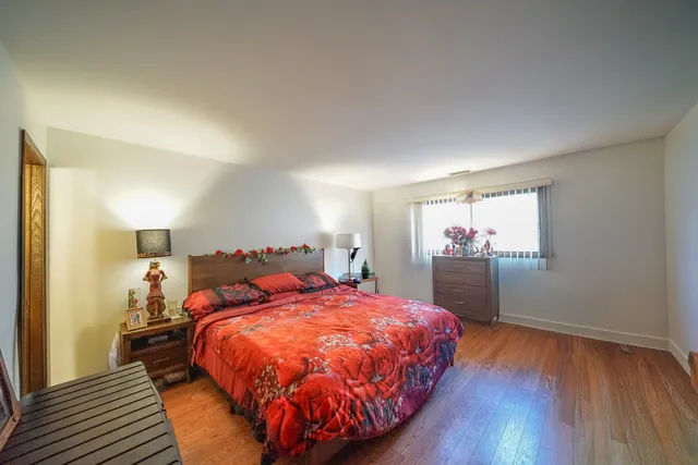 a bed room with a bed and a window