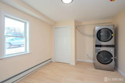a view of a hallway with washer and dryer