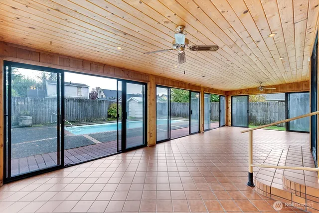 a view of an empty room with glass door