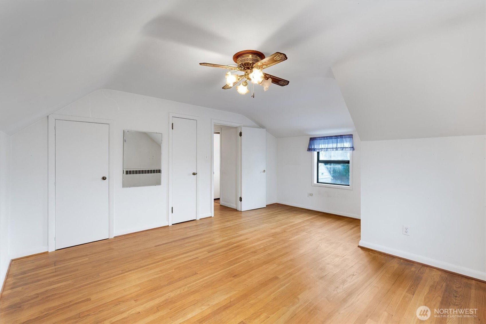 2727 Hemlock Street Longview, WA 98632 - Photo 21 of 40 a view of empty room with wooden floor and fan