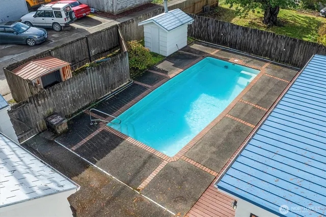 a view of a backyard with sitting area