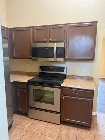 a kitchen with a stove and a microwave