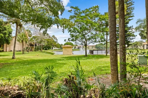 a swimming pool with outdoor seating and yard