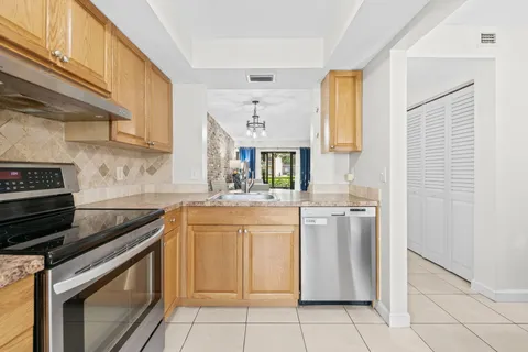 a view of a hallway with washer and dryer