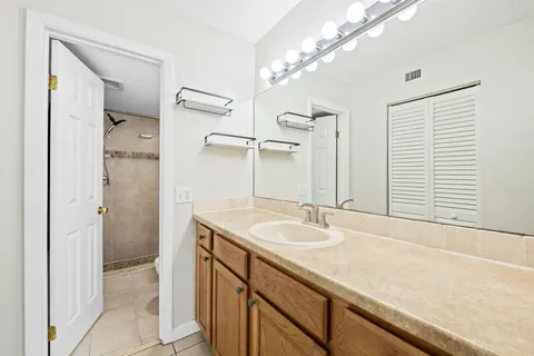 a bathroom with a shower curtain and a sink