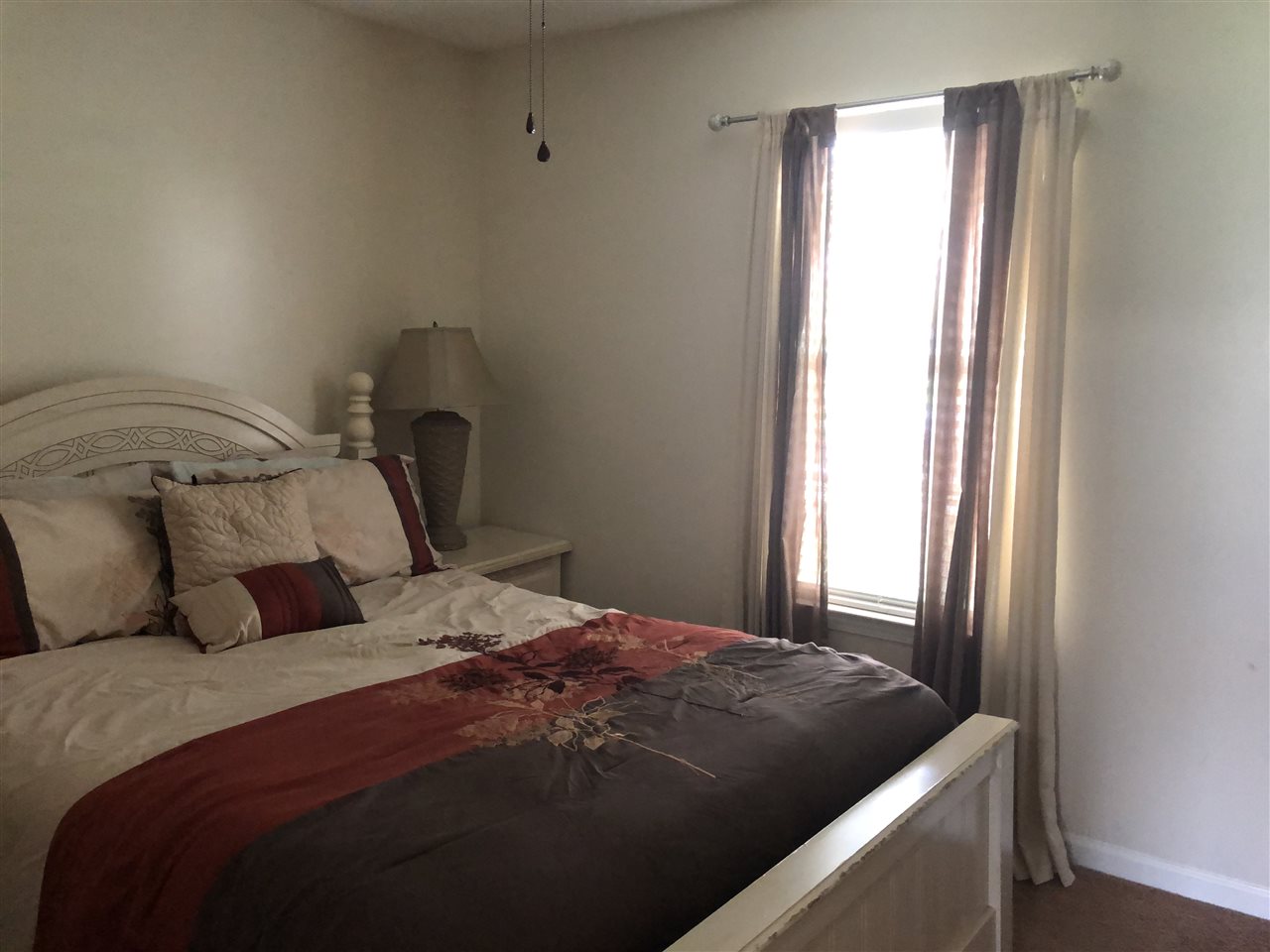 5509 Edwin Forest Road Memphis, TN 38141 - Photo 17 of 19 a bedroom with a bed and a window