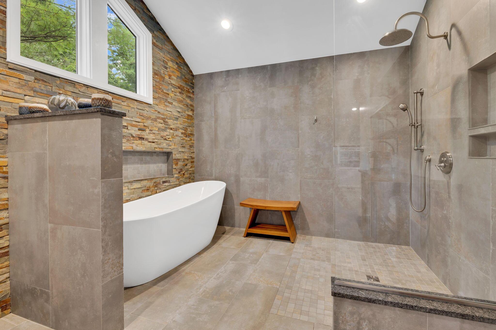 4972 Red Bank Road Galena, OH 43021 - Photo 43 of 123 Modern bath featuring a freestanding tub, spacious walk-in shower with a rain showerhead.