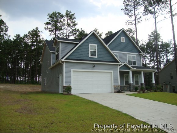 717 Sun Road Aberdeen, NC 28315 - Photo 1 of 14 a front view of a house with a yard