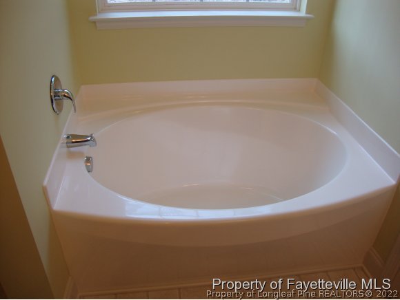 717 Sun Road Aberdeen, NC 28315 - Photo 13 of 14 a close up of a bathtub