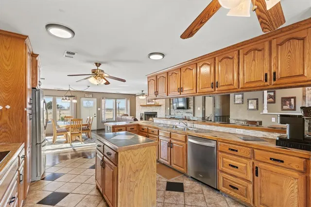 a kitchen with a stove a sink and a refrigerator