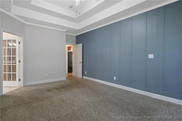a view of an empty room with windows