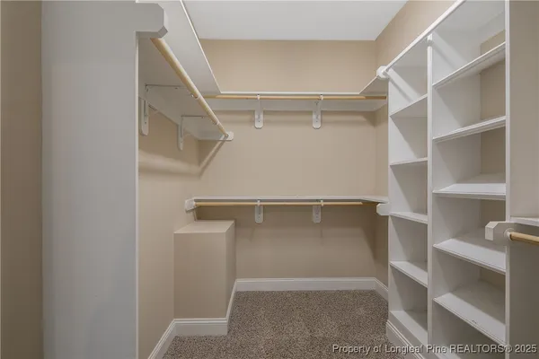 a view of an empty walk in closet