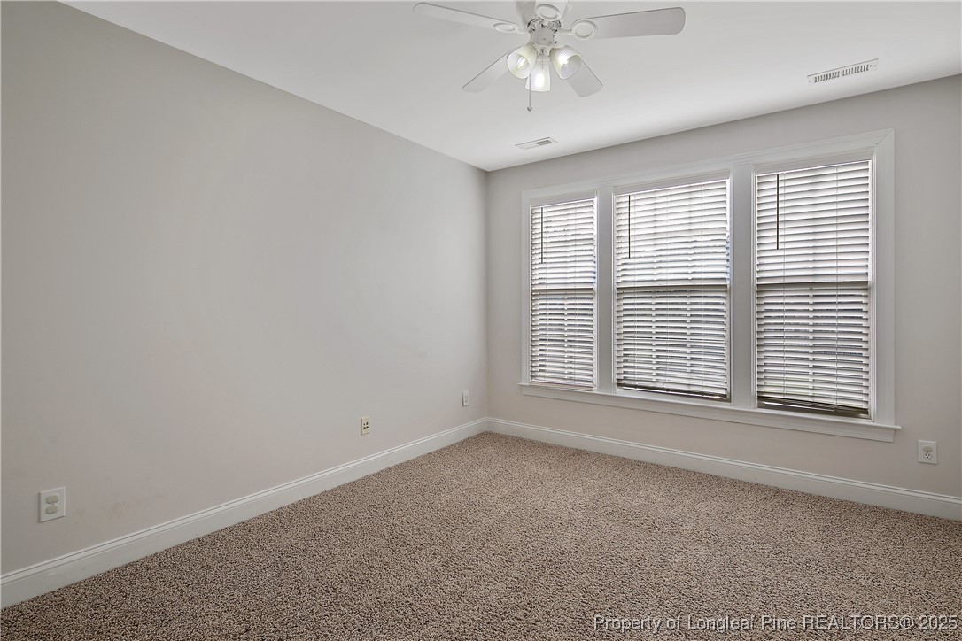 399 Falling Water Road Spring Lake, NC 28390 - Photo 36 of 50 a view of an empty room with a window