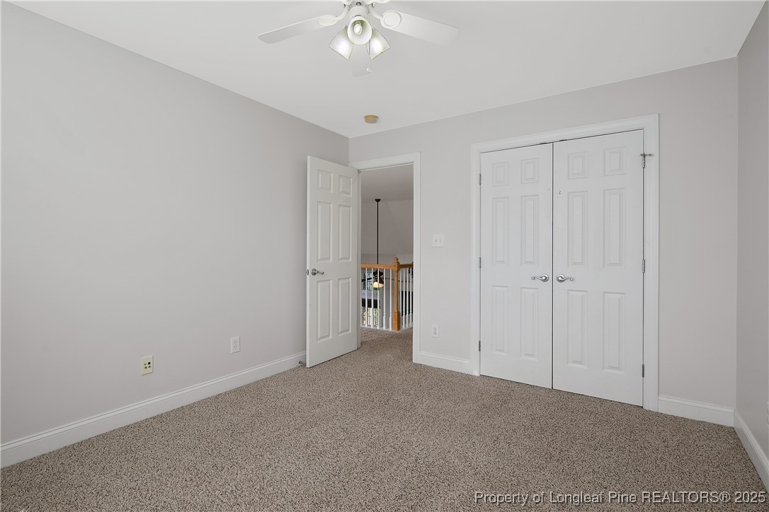 399 Falling Water Road Spring Lake, NC 28390 - Photo 37 of 50 a view of an empty room and a chandelier fan