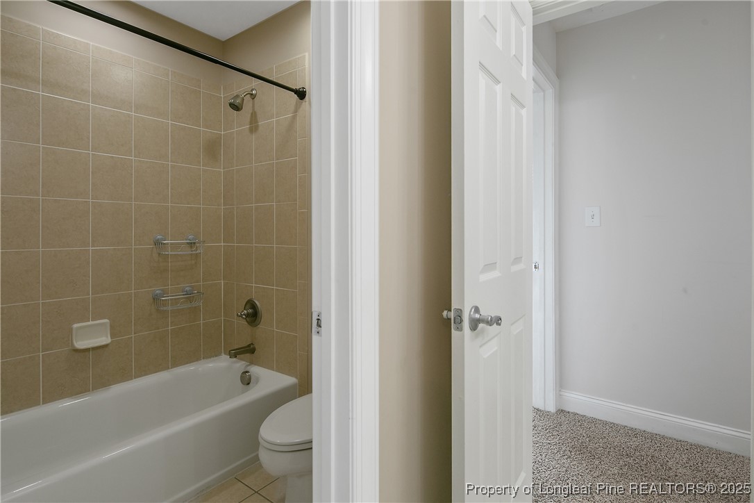 399 Falling Water Road Spring Lake, NC 28390 - Photo 40 of 50 a bathroom with a bathtub shower and toilet