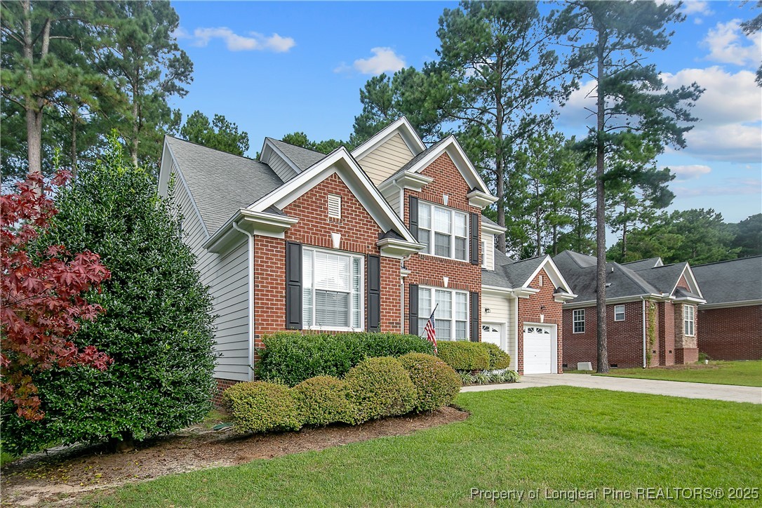 399 Falling Water Road Spring Lake, NC 28390 - Photo 4 of 50 a front view of a house with a garden
