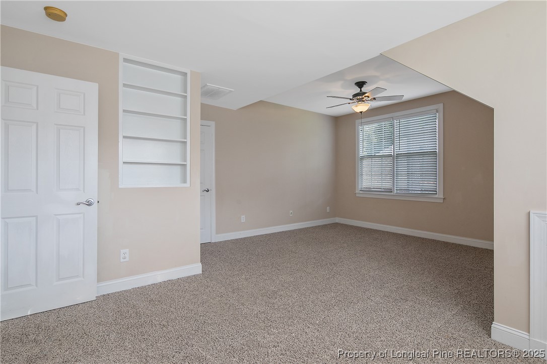 399 Falling Water Road Spring Lake, NC 28390 - Photo 46 of 50 an empty room with windows and closet
