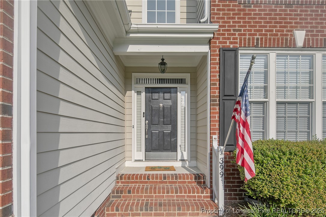 399 Falling Water Road Spring Lake, NC 28390 - Photo 5 of 50 a front view of a house with wooden floor
