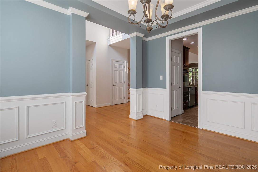 399 Falling Water Road Spring Lake, NC 28390 - Photo 9 of 50 wooden floor in an empty room with a window