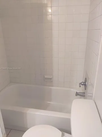 a bathroom with a sink and toilet