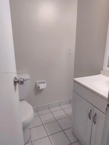 a view of an empty room and fire place