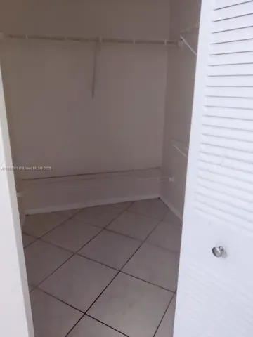 a bathroom with a bathtub and a toilet